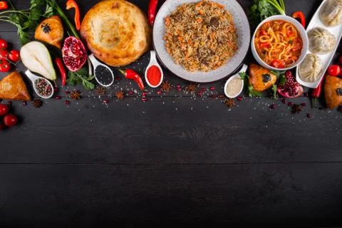 The concept of Eastern festive cuisine. Assorted Uzbek food set, pilaf, samsa Stock Photos