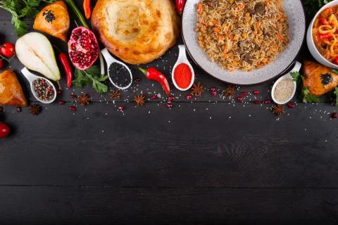 The concept of Eastern festive cuisine. Assorted Uzbek food set, pilaf, samsa Stock-Fotos