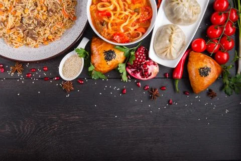 The concept of Eastern festive cuisine. Assorted Uzbek food set, pilaf, samsa Stock Photos