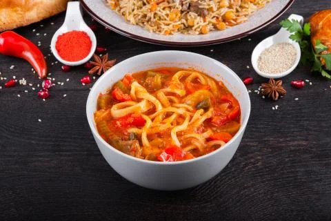 The concept of Eastern festive cuisine. Assorted Uzbek food set, pilaf, samsa Stock Photos