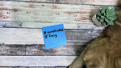 Concept of Easy or Complicated write on sticky notes isolated on Wooden Table Stock Photos
