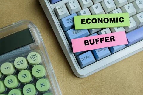 Concept of economic buffer write on sticky notes isolated on Wooden Table. Stock Photos
