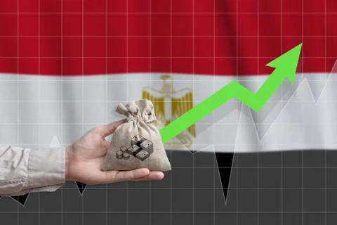 The concept of economic growth in Arab Republic of Egypt. Hand holds a bag wi Stock Photos