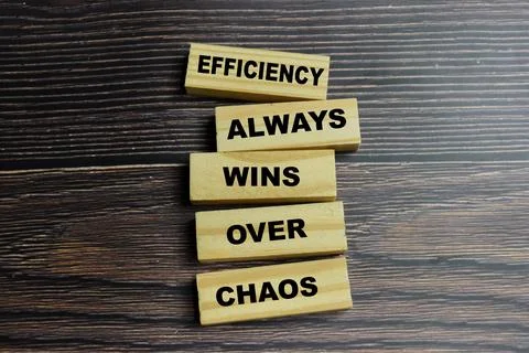 Concept of efficiency always wins over chaos text on wooden blocks. Stock Photos