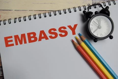 Concept of Embassy write on book isolated on Wooden Table. Fotos de archivo