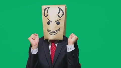 Concept of emotion, gestures. a man with a package on his head, with a painted Stock Footage 96710374