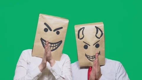 Concept of emotions, gestures. a man with a package on his head, with a painted Stock Footage 96713314