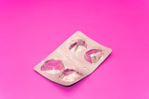 Concept Empty pill blister pack, pink background, virus and disease, pill Stock Photos
