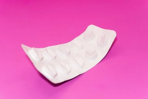 Concept Empty pill blister pack, pink background, virus and disease, pill Stock Photos