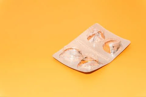 Concept Empty pill blister pack, peach color background, virus and disease, pill Stock Photos