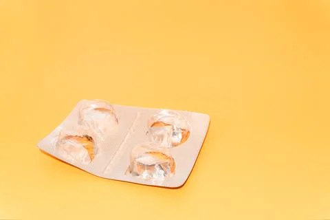 Concept Empty pill blister pack, peach color background, virus and disease, pill Stock Photos