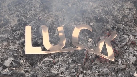 The concept of the end of good luck or success. The symbol of fortune is on fire Stock Footage 118776645