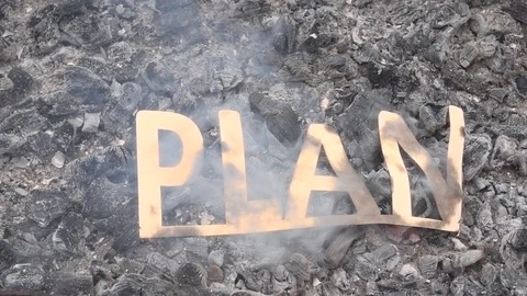 The concept of ending a plan or design. The project symbol is on fire. Stock Footage 118619449