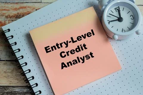 Concept of entry-level credit analyst write on sticky notes Stock Photos