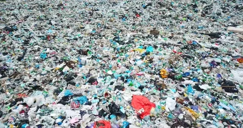 The concept of environmental pollution by unsorted garbage. Huge dumps of Stock Footage 173518040