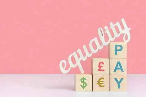 The concept of equal pay. The word equality stands on wooden cubes with dolla Stock Photos