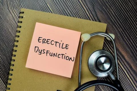 Concept of Erectile Dysfunction write on sticky notes isolated on Wooden Table Stock Photos