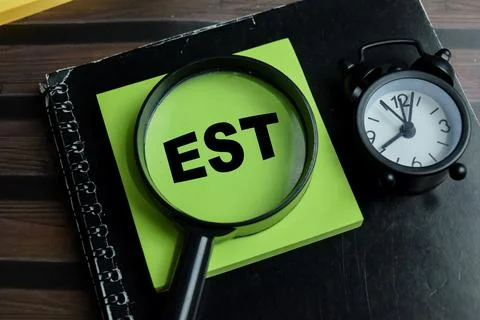 Concept of EST - Earliest Starting Time write on sticky notes Stock Photos