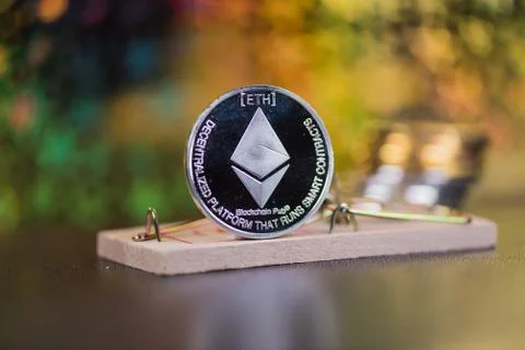 Concept of ethereum in a  mouse trap. Risks and dangers of investing in the c Stock Photos