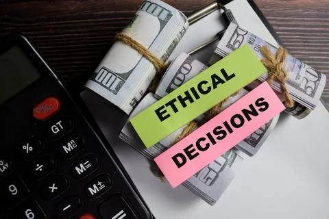 Concept of ethical decisions write on sticky notes isolated on Wooden Table. Stockfoto's