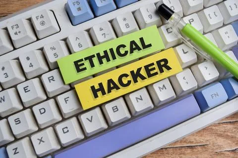 Concept of ethical hacker write on sticky notes isolated on Wooden Table. Stockfoto's