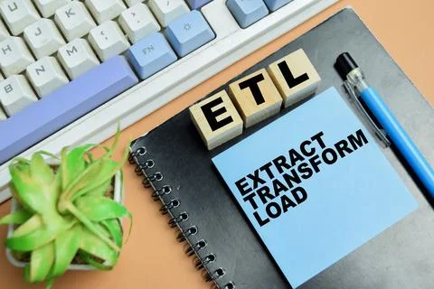 Concept of ETL - Extract Transform Load write on sticky notes Stock Photos
