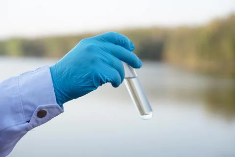 Concept, explore, inspect quality of water from natural source. Stock Photos