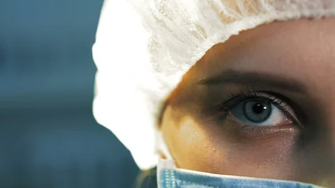 Concept extra close-up of the eye tired nurse. 库存影片 113664559