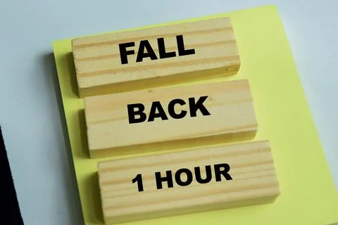 Concept of fall back 1 hour text on wooden blocks. Stock Photos