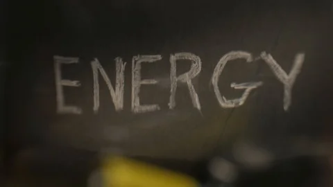 The concept of falling AA batteries on the background of the inscription Energy Stock Footage 123800761