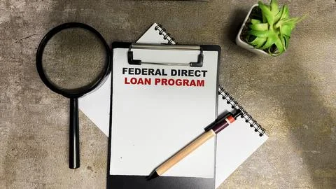 Concept of Federal Direct Loan Program write on paperwork Fotos de archivo