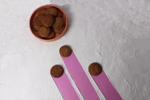 The concept of fertilization of an egg with sperm. Three cookies are aiming f Stock Photos