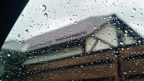Concept footage of the car window covered by rain drops. Abstract Stock Footage 260832047