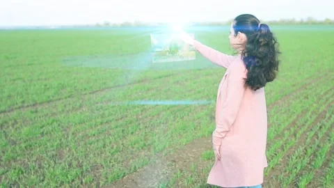 The concept of future technologies in agriculture. The farmer chooses the nec Stock Footage 137603554