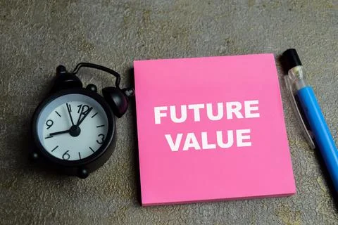 Concept of future value write on sticky notes isolated on Wooden Table. Stock Photos