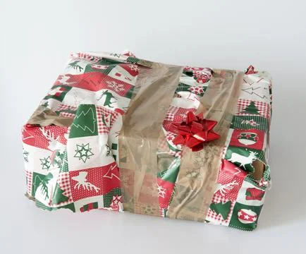 Concept - gift for people you dont like. Badly wrapped present in kitsch Chri Stock Photos