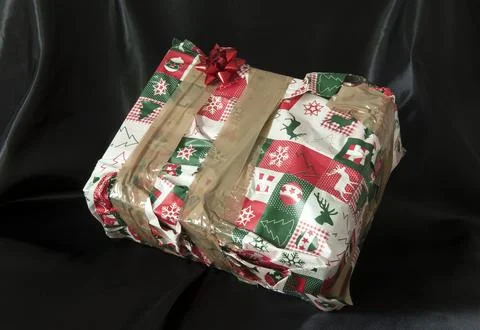 Concept - gift for people you dont like. Badly wrapped present in kitsch Chri Stock Photos
