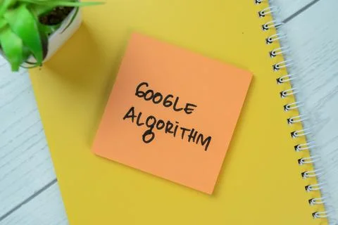Concept of Google Algorithm write on sticky notes isolated on Wooden Table. 库存照片