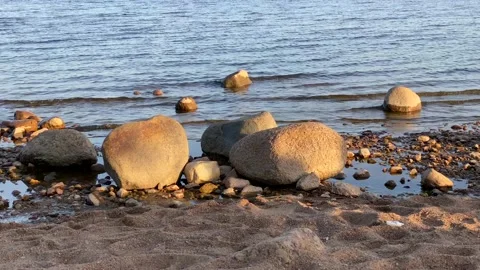 The concept of harmony, balance and simplicity. Stones on the beach. Video stock 132088371
