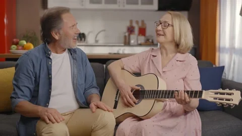 Concept of having fun together, singing with guitar. Stock Footage 148689303