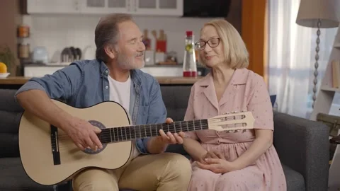 Concept of having fun together, singing with guitar. Stock Footage 148689572