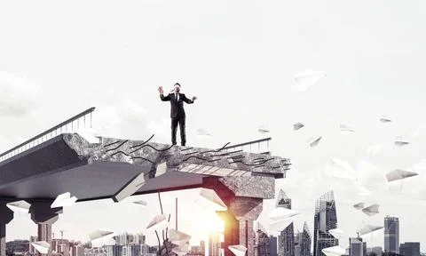 Concept of hidden risks and dangers. Businessman walking blindfolded among... Stock Photos