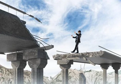 Concept of hidden risks and dangers. Businessman walking blindfolded on co... Stock Photos