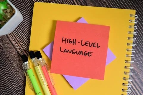 Concept of High-Level Language write on sticky notes isolated on Wooden Table 库存照片