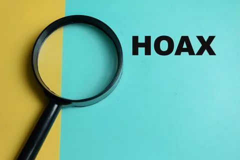 Concept of hoax write on color background with magnifying glass. Stock Photos