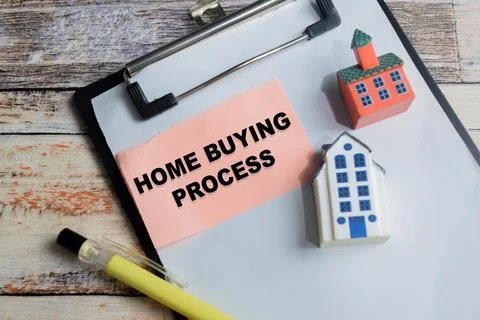 Concept of home buying process write on sticky notes isolated on Wooden Table 스톡 사진