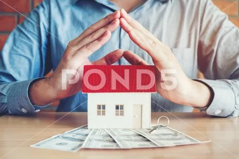 The concept of home ownership and dollars bills Stock Photos