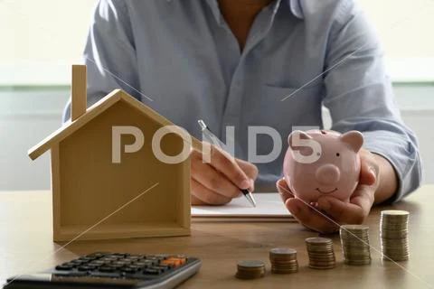 The concept of home ownership Business people negotiating a contract This is Stock Photos