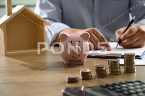 The concept of home ownership Business people negotiating a contract This is Stock Photos