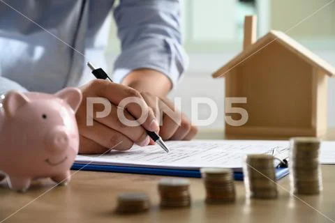 The concept of home ownership Business people negotiating a contract This is Stock Photos